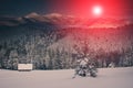 Landscape of mountains winter. View of snow-covered conifer trees at sunrise. Retro filter. Royalty Free Stock Photo