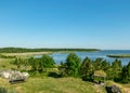 Landscape with a naturally decorated seating area, wooden table and bench, summer landscape