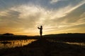 Landscape nature scene of women shooting the photo at dramatic sky Royalty Free Stock Photo