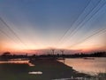 Landscape nature scenery in evening show with electric posts and lines .