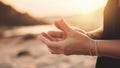 Hand of woman practicing meditation yoga on nature sunset Royalty Free Stock Photo