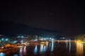 Landscape night view and Constellations of stars at night a small village in the middle of the mountains With a large river and