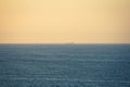 Tanker ship sailing through the sea at sunset Royalty Free Stock Photo