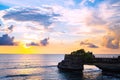 Landscape, Ocean in sunset with cliff and natural arch at Tanah lot, Bali Royalty Free Stock Photo