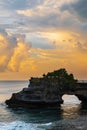 Landscape, Ocean in sunset with cliff and natural arch at Tanah lot, Bali Royalty Free Stock Photo