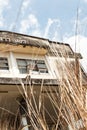 Landscape of old abandoned theater facade, view from bottom up to sky Royalty Free Stock Photo