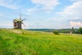 Field and windmill at the sky sunset background. Royalty Free Stock Photo