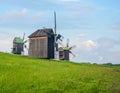 Landscape with old rural windmills in the countryside. Royalty Free Stock Photo