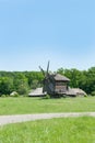 Landscape with old wooden windmills Royalty Free Stock Photo