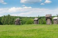 Landscape with old wooden windmills Royalty Free Stock Photo