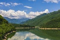 Landscape with Olt river in Romania surrounded by forest and mountains