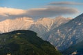 Landscape of the Olympus mountain range. View of a high rocky peaks in the distance and hillsides are covered with forest.