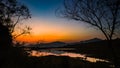 Landscape with orange and purple at sunset  silhouettes of mountains Royalty Free Stock Photo