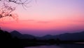 Landscape with orange and purple at sunset  silhouettes of mountains Royalty Free Stock Photo