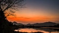 Landscape with orange and purple at sunset  silhouettes of mountains Royalty Free Stock Photo