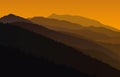 Landscape with orange silhouettes of mountains Royalty Free Stock Photo