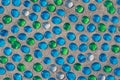 White, blue and green glass beads on sand Royalty Free Stock Photo