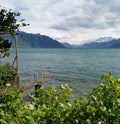 Landscape over lake Geneva and the dents du midi with clouds as background Royalty Free Stock Photo