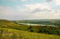 Summer landscape overlooking the reservoir and mountains. Royalty Free Stock Photo