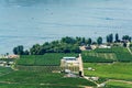 Landscape overview with farmer`s house at Okanagan lake on sunny summer day. Royalty Free Stock Photo