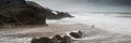 Landscape panorama of Mumbles lighthouse in Wales with sunbeams Royalty Free Stock Photo