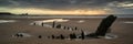 Landscape panorama ship wreck on Rhosilli Bay beach in Wales at Royalty Free Stock Photo