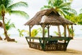 Landscape of paradise tropical island with palms cottages and white sand beach Royalty Free Stock Photo