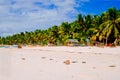 Landscape of paradise tropical island with palms, cottages and white sand beach in Asia Royalty Free Stock Photo