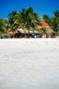 Landscape of paradise tropical island with palms and white sand beach Royalty Free Stock Photo