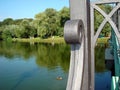 Landscape Park with a lake and forged element of the bridge