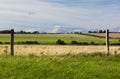 Landscape of pasture with barb wire fence Royalty Free Stock Photo