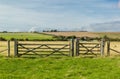 Landscape of pasture with barb wire and wooden fence Royalty Free Stock Photo