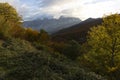 Landscape of Peaks of Europe national park at sunset with bright sunset sky and autumn forest with colorful yellow and orange Royalty Free Stock Photo