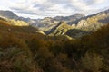 Landscape of Peaks of Europe national park at sunset with bright sunset sky and autumn forest with colorful yellow and orange Royalty Free Stock Photo