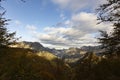 Landscape of Peaks of Europe national park at sunset with bright sunset sky and autumn forest with colorful yellow and orange Royalty Free Stock Photo