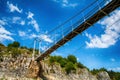 Landscape with pedestrian bridge at river Uvac gorge Royalty Free Stock Photo