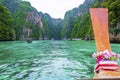 Landscape of Phi Phi Islands covered in greenery surrounded by boats under sunlight Royalty Free Stock Photo