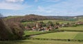 Landscape photo of the characterful village of Fingest in the Chiltern Hills, surrounded by farming land.