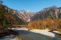 Landscape photo of Japan Alps with snow on top of mountain in autumn at Kamikochi, Japan.