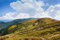 Landscape photo of mountain hills with blue sunny day sky Royalty Free Stock Photo