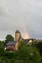 Landscape photo of Muerlenbach in the Eifel in summer with a rainbow and Bertrada Castle