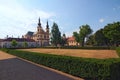 Landscape photo of Piarist Church of the Discovery. View from the park in the Castle Litomysl by summer day Royalty Free Stock Photo