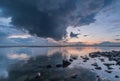 Reflecting lake during sunset with heavy clouds, Ijselmeer Holland