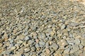 The Norman pebbles of the beach of the Old Church in Europe, France, Normandy, Manche, in spring, on a sunny day Royalty Free Stock Photo