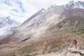 Landscape photographer shooting a glacier, working in Himalayas mountain Royalty Free Stock Photo