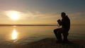 Landscape photographer taking a pictures of sunset