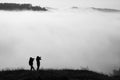 Landscape photographers on the field in the misty morning