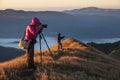Landscape photographers on the mountain top early in the morning