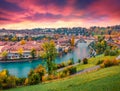 Landscape photography. Fantastic evening view of Bern town with Pont de Nydegg bridge and Nydeggkirche - Protestant church on back Royalty Free Stock Photo