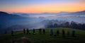 Landscape photography workshop. Photographers on course during mountain sunrise. Hills and villages with foggy morning. Fog in Cze Royalty Free Stock Photo